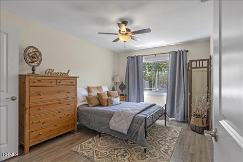 22150 Buena Vista St, Tehachapi, CA 93561 - bedroom featuring wood finished floors and a ceiling fan