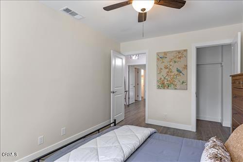 22150 Buena Vista St, Tehachapi, CA 93561 - bedroom with wood finished floors, a closet, and a ceiling fan