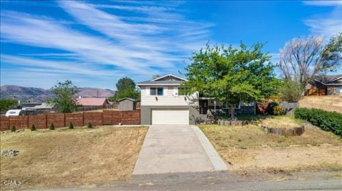 22150 Buena Vista St, Tehachapi, CA 93561 - view of front facade with an attached garage and concrete driveway