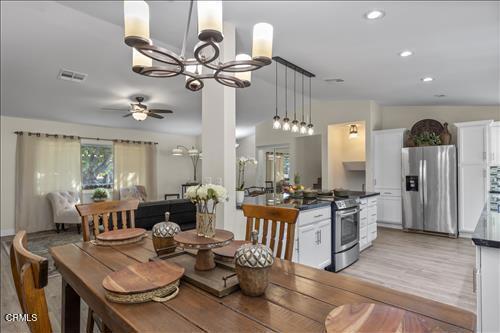 22150 Buena Vista St, Tehachapi, CA 93561 - dining room with a chandelier, a ceiling fan, light wood-style flooring, and recessed lighting