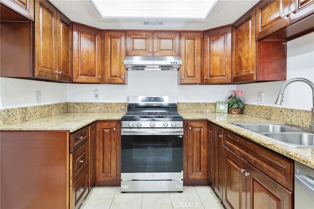 1707 Pepper St Unit A, Alhambra, CA 91801 - kitchen with appliances with stainless steel finishes, under cabinet range hood, a sink, light tile patterned floors, and light stone counters