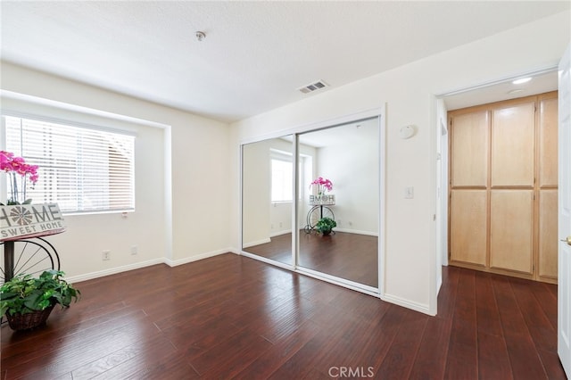 1707 Pepper St Unit A, Alhambra, CA 91801 - unfurnished bedroom featuring baseboards, a closet, and dark wood finished floors