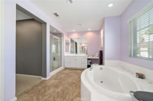 4127 Poplar Cir, Lake Elsinore, CA 92530 - full bathroom with vanity, a shower stall, a bath, and recessed lighting