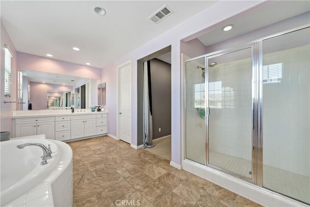 4127 Poplar Cir, Lake Elsinore, CA 92530 - full bathroom featuring vanity, a stall shower, a bath, plenty of natural light, and recessed lighting