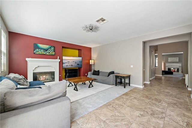 4127 Poplar Cir, Lake Elsinore, CA 92530 - living area featuring a glass covered fireplace and baseboards