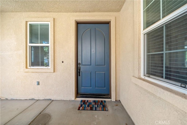 4127 Poplar Cir, Lake Elsinore, CA 92530 - doorway to property featuring stucco siding