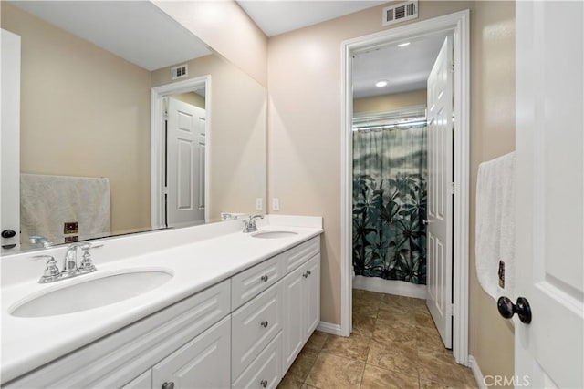 4127 Poplar Cir, Lake Elsinore, CA 92530 - full bath featuring double vanity and a shower with shower curtain