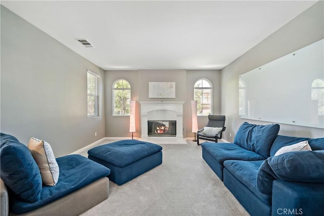 4127 Poplar Cir, Lake Elsinore, CA 92530 - living area with carpet flooring, plenty of natural light, and a glass covered fireplace