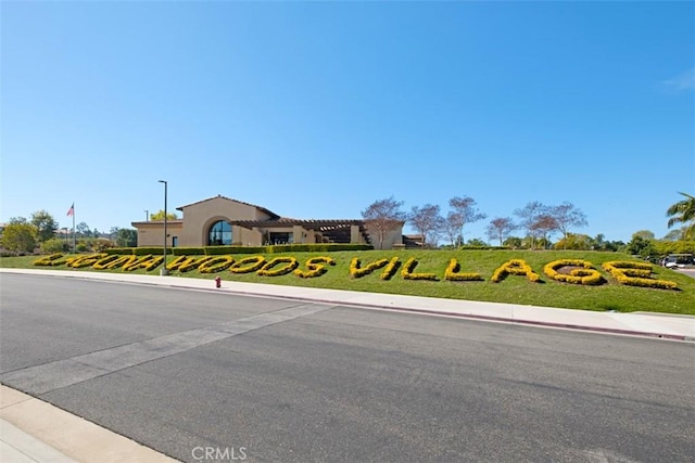 5437 Via Carrizo, Laguna Woods, CA 92637 - view of asphalt street with street lights, sidewalks, and curbs