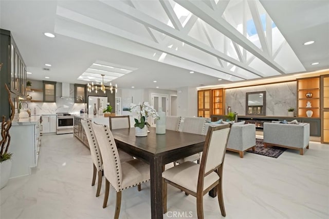 5437 Via Carrizo, Laguna Woods, CA 92637 - dining area featuring a chandelier, recessed lighting, and light marble finish floors