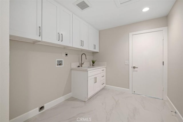 5437 Via Carrizo, Laguna Woods, CA 92637 - laundry room featuring hookup for an electric dryer, hookup for a washing machine, cabinet space, light marble finish flooring, and baseboards