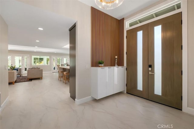 5437 Via Carrizo, Laguna Woods, CA 92637 - entrance foyer with french doors, marble finish floors, baseboards, a chandelier, and recessed lighting