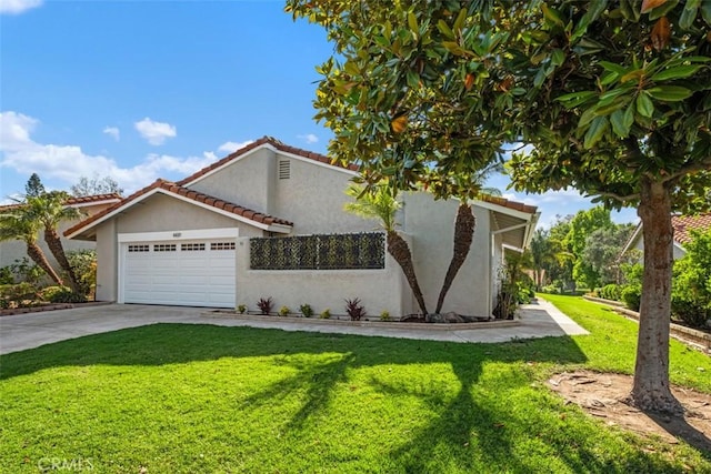 5437 Via Carrizo, Laguna Woods, CA 92637 - mediterranean / spanish house featuring stucco siding, a garage, a front lawn, driveway, and a tiled roof