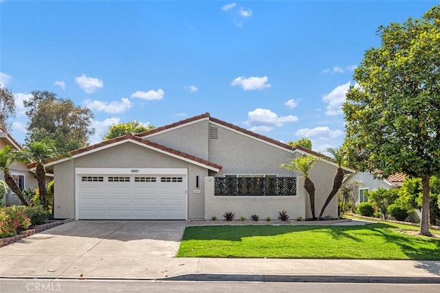 5437 Via Carrizo, Laguna Woods, CA 92637 - view of front facade with a garage, stucco siding, driveway, and a front yard