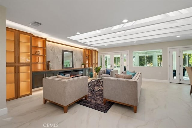 5437 Via Carrizo, Laguna Woods, CA 92637 - living room featuring light marble finish floors, french doors, baseboards, and recessed lighting