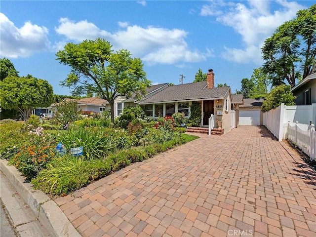 4854 Ranchito Ave, Sherman Oaks, CA 91423 - single story home with decorative driveway and a chimney