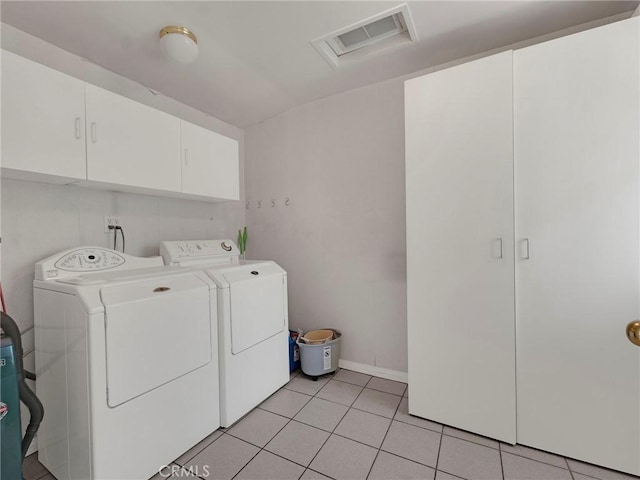 4854 Ranchito Ave, Sherman Oaks, CA 91423 - laundry room with cabinet space, separate washer and dryer, light tile patterned floors, and baseboards