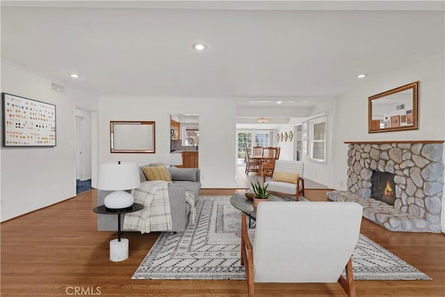 4854 Ranchito Ave, Sherman Oaks, CA 91423 - living room featuring wood finished floors, a fireplace, and recessed lighting
