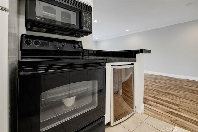 3605 W Hidden Ln Unit 307, Rolling Hills Estates, CA 90274 - kitchen featuring black appliances, beverage cooler, baseboards, light tile patterned floors, and crown molding