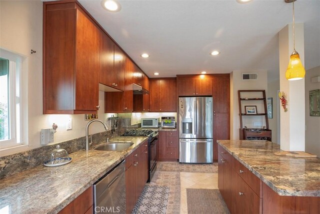 4 Amherst, Laguna Niguel, CA 92677 - kitchen featuring stainless steel appliances, under cabinet range hood, a sink, light stone countertops, and recessed lighting
