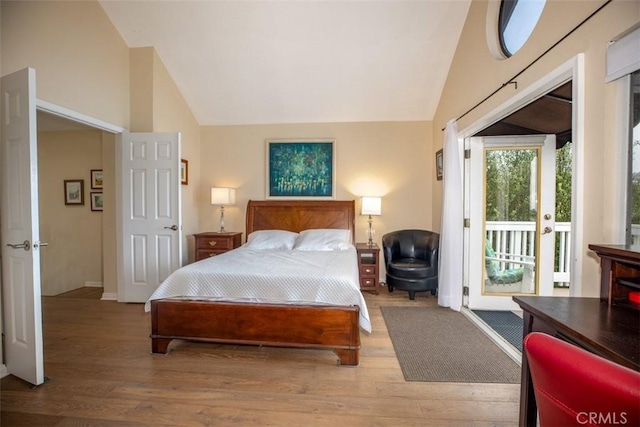 4 Amherst, Laguna Niguel, CA 92677 - bedroom with vaulted ceiling, access to exterior, and wood finished floors