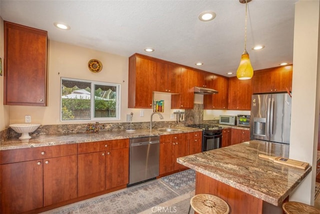 4 Amherst, Laguna Niguel, CA 92677 - kitchen with appliances with stainless steel finishes, stone counters, recessed lighting, under cabinet range hood, and pendant lighting