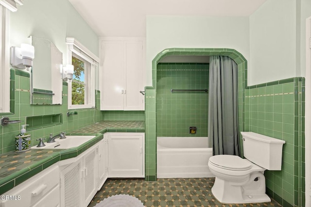 346 Stedman Pl, Monrovia, CA 91016 - bathroom with vanity, tile walls, shower / tub combo, and tile patterned flooring