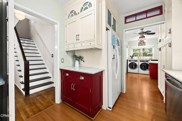 346 Stedman Pl, Monrovia, CA 91016 - kitchen with washer and dryer, dishwasher, white refrigerator with ice dispenser, and wood finished floors