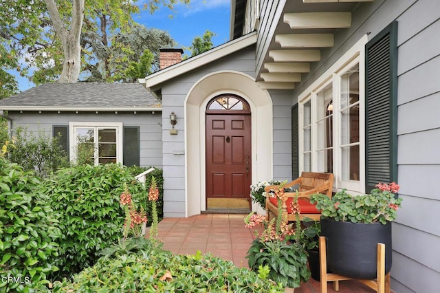 346 Stedman Pl, Monrovia, CA 91016 - view of exterior entry with a chimney and a shingled roof