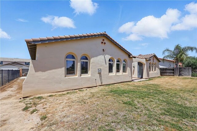 13045 Ridgewood Way, Chowchilla, CA 93610 - rear view of property with stucco siding and a tile roof