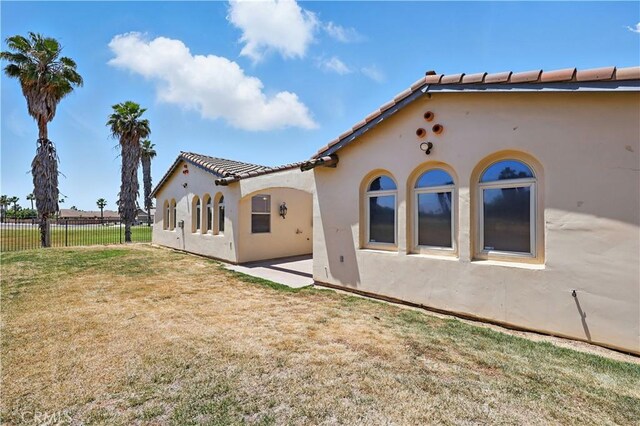 13045 Ridgewood Way, Chowchilla, CA 93610 - back of property featuring stucco siding and a tiled roof