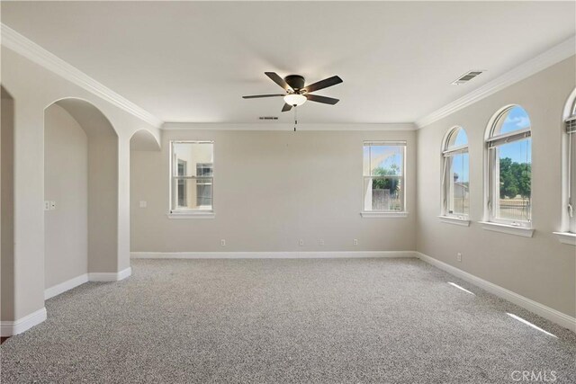 13045 Ridgewood Way, Chowchilla, CA 93610 - spare room featuring a ceiling fan, light colored carpet, crown molding, and baseboards