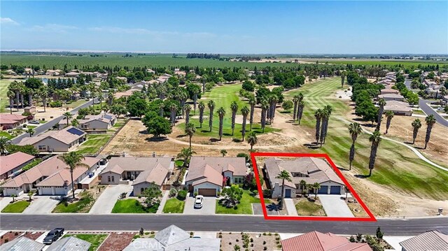 13045 Ridgewood Way, Chowchilla, CA 93610 - aerial perspective of suburban area featuring property boundaries highlighted and a golf club