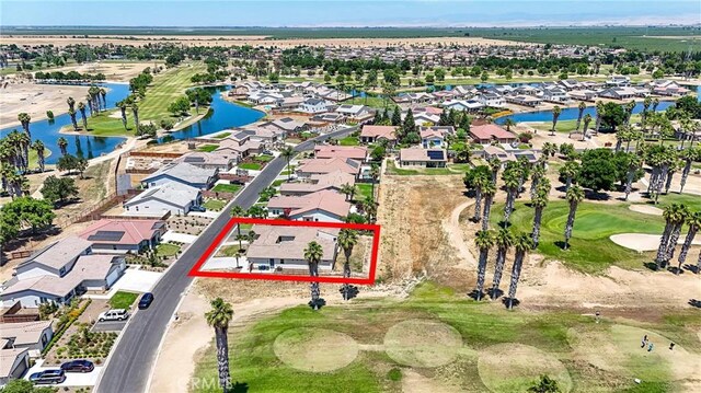 13045 Ridgewood Way, Chowchilla, CA 93610 - aerial view of property and surrounding area featuring property parcel outlined, nearby suburban area, and a golf course