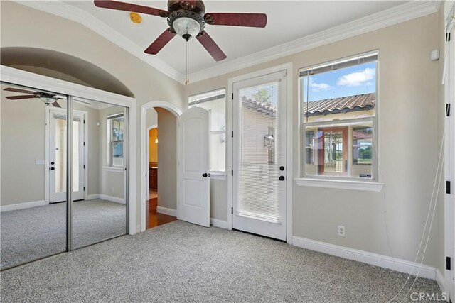 13045 Ridgewood Way, Chowchilla, CA 93610 - unfurnished bedroom with arched walkways, carpet, ornamental molding, baseboards, and a ceiling fan