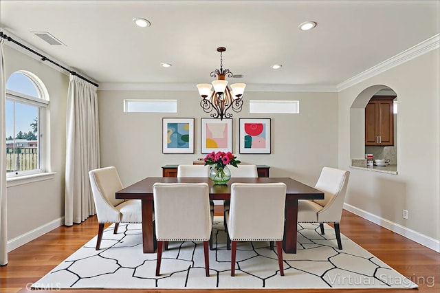 13045 Ridgewood Way, Chowchilla, CA 93610 - dining room featuring ornamental molding, light wood finished floors, a chandelier, recessed lighting, and baseboards