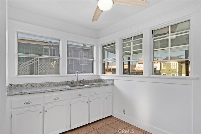 1914 S W View St, Los Angeles, CA 90016 - bar featuring a sink, light tile patterned floors, a ceiling fan, and baseboards