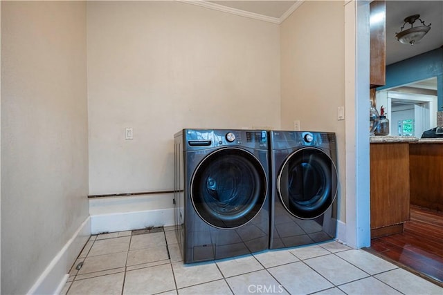 1914 S W View St, Los Angeles, CA 90016 - washroom featuring ornamental molding, washer and dryer, baseboards, and light tile patterned floors