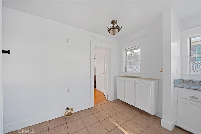 1914 S W View St, Los Angeles, CA 90016 - unfurnished dining area featuring light tile patterned floors and baseboards