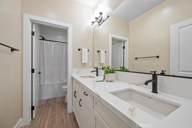 176 Tango Way, San Luis Obispo, CA 93401 - bathroom featuring double vanity, shower / bath combo with shower curtain, and wood finish floors
