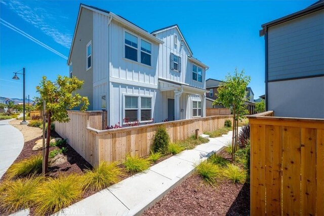 176 Tango Way, San Luis Obispo, CA 93401 - view of front of house featuring board and batten siding and a fenced front yard