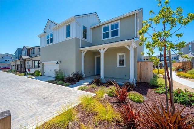 176 Tango Way, San Luis Obispo, CA 93401 - view of front of home featuring an attached garage, stucco siding, a residential view, a porch, and board and batten siding