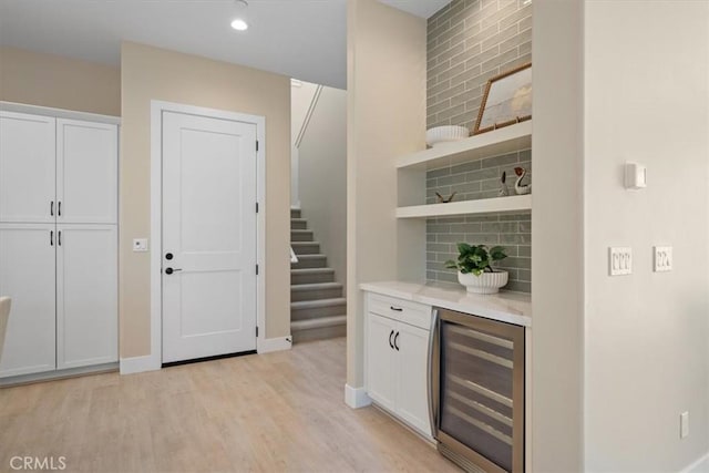 176 Tango Way, San Luis Obispo, CA 93401 - bar featuring beverage cooler, light wood-style floors, tasteful backsplash, stairs, and recessed lighting