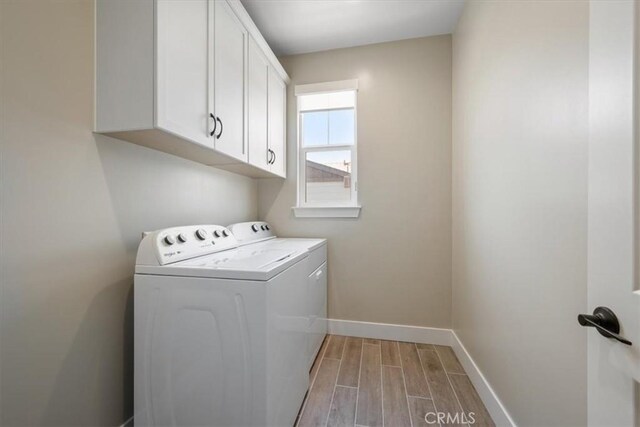 176 Tango Way, San Luis Obispo, CA 93401 - laundry area with separate washer and dryer, cabinet space, and wood tiled floors