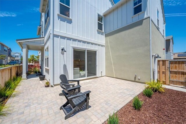 176 Tango Way, San Luis Obispo, CA 93401 - rear view of house featuring board and batten siding and a patio area