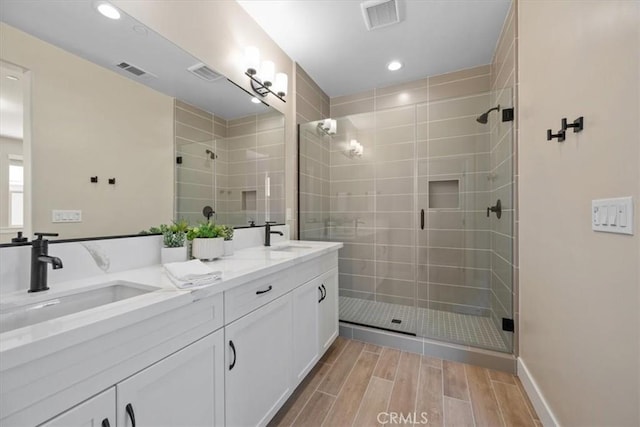 176 Tango Way, San Luis Obispo, CA 93401 - full bath with wood tiled floors, double vanity, a shower stall, and recessed lighting