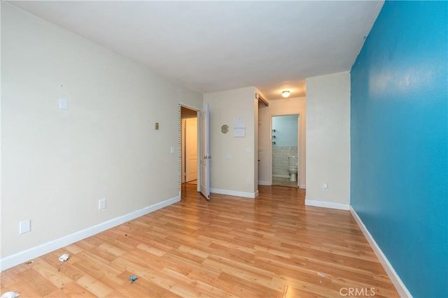 3505 Angelucci St Unit 2E, San Diego, CA 92111 - spare room with light wood-style flooring and baseboards