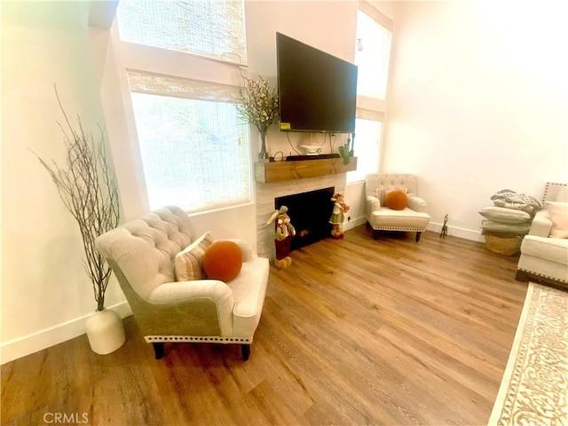 2416 Hialeah Cir, Norco, CA 92860 - living room with wood finished floors, plenty of natural light, a fireplace, and a towering ceiling
