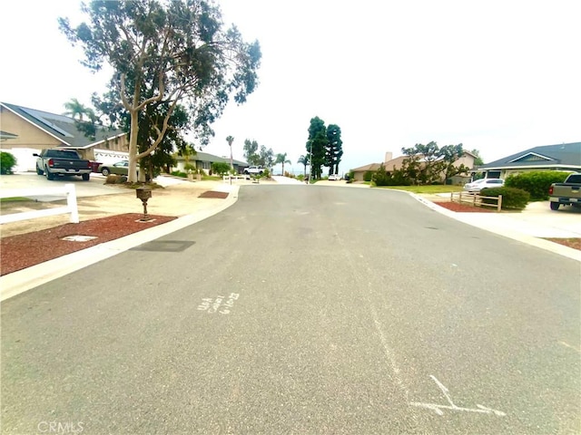 2416 Hialeah Cir, Norco, CA 92860 - view of asphalt road with a residential view