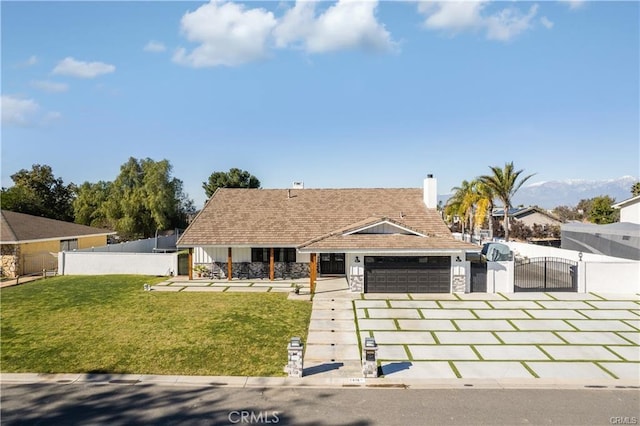 2416 Hialeah Cir, Norco, CA 92860 - view of front of home featuring a gate, an attached garage, driveway, stone siding, and a chimney